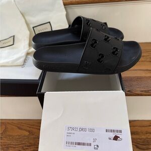 Gucci Black Rubber GG Slide Sandals